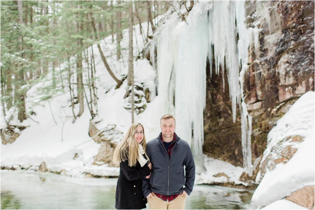 man and woman in front of icicles