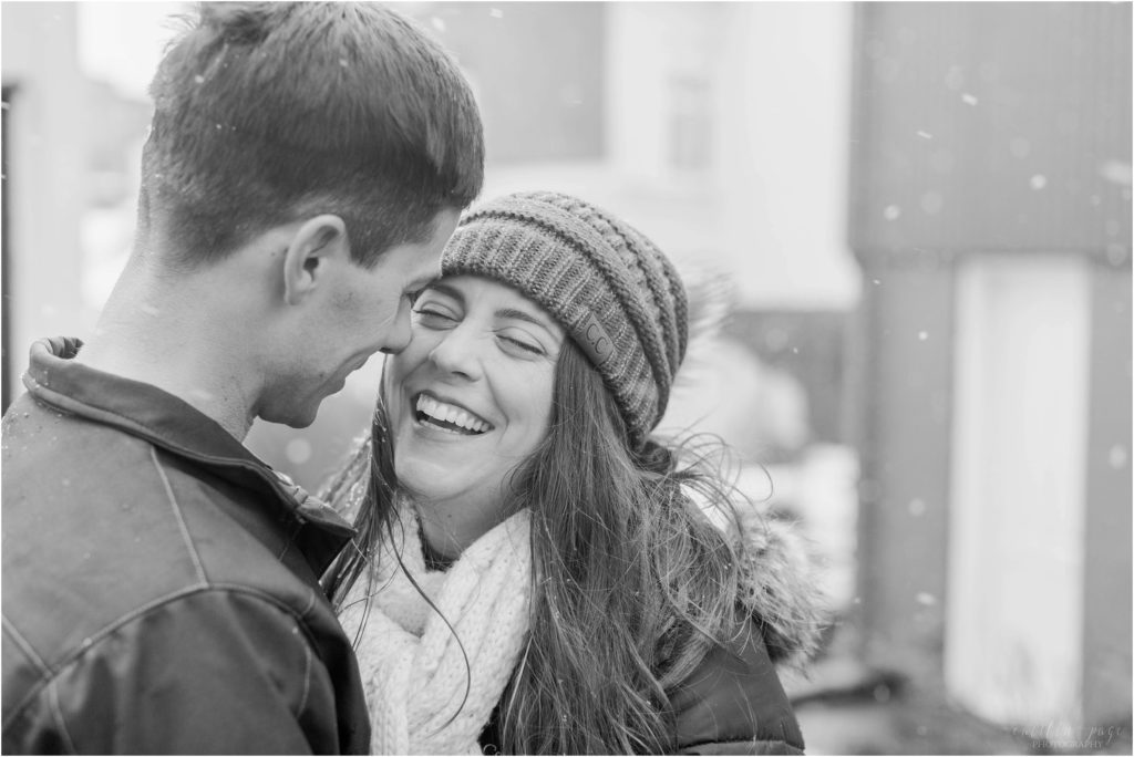 black and white photo couple in snowstorm