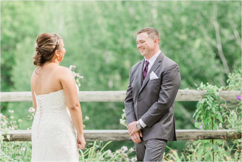 groom seeing bride for first time at wedding