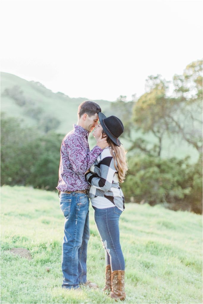 man and woman kissing california hills