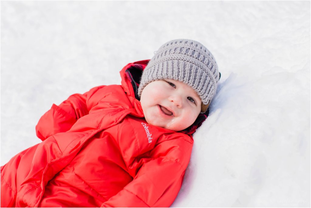 baby laying down in snow