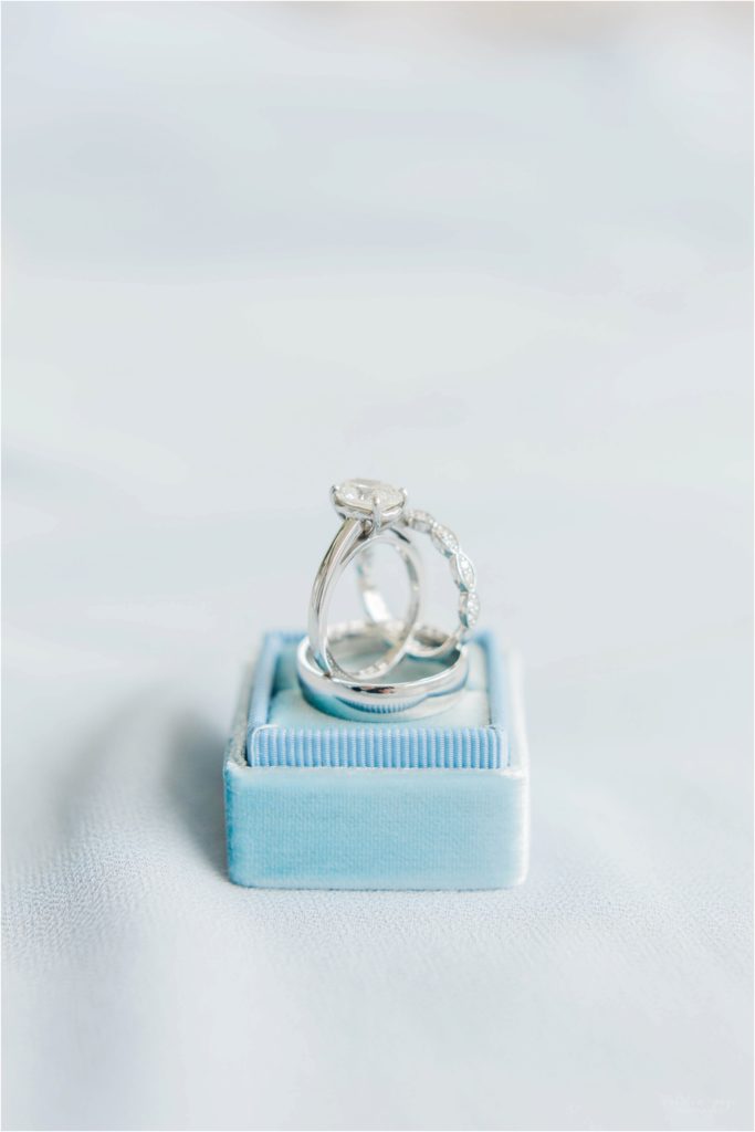 wedding rings and blue ring box