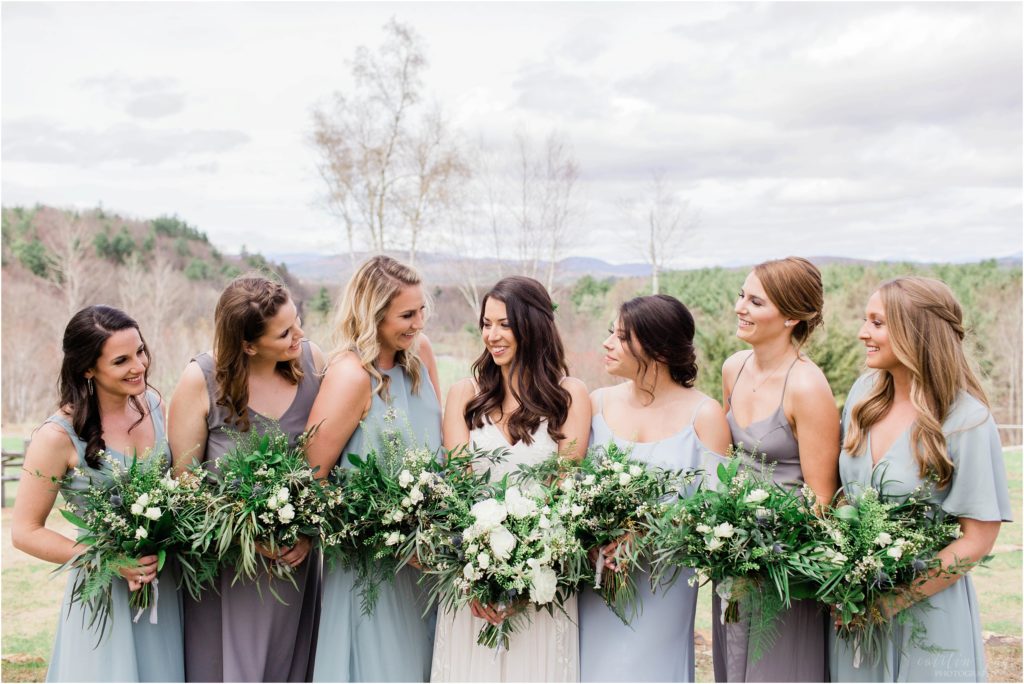bridesmaids smiling at each other