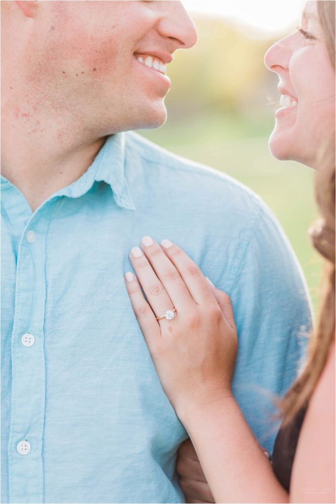 engagement ring with man and woman looking at each other