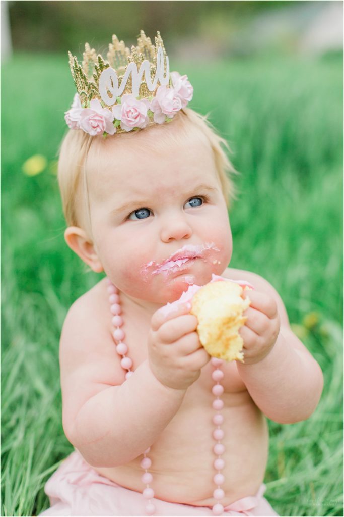 baby eating a cupcake
