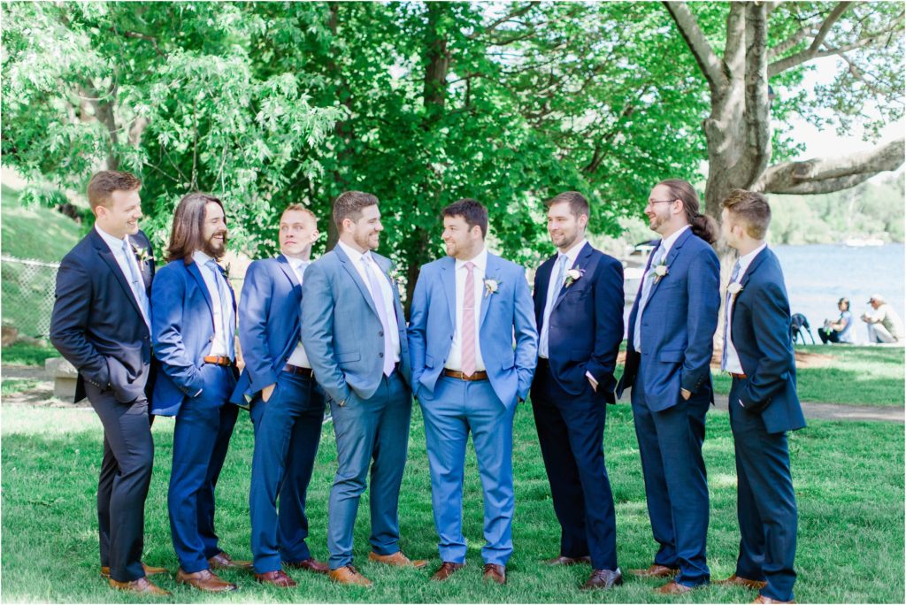 groomsmen in blue suits outside