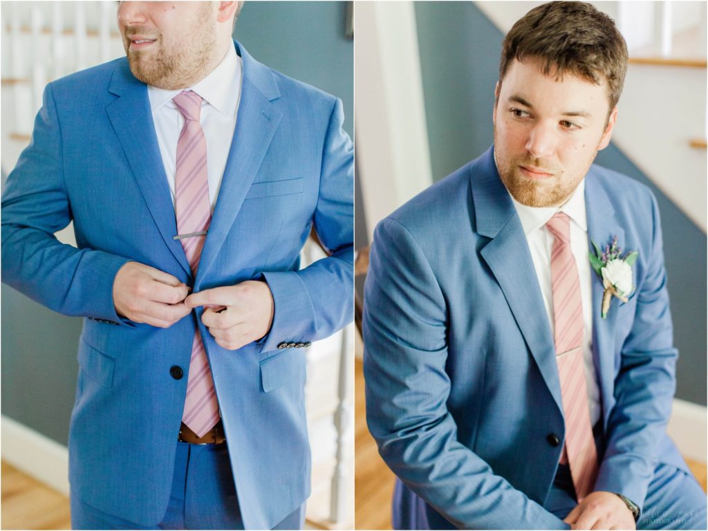 groom in blue suit getting ready