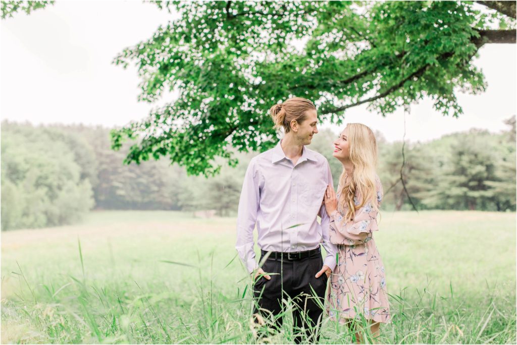 Man and woman looking at each other in a tree