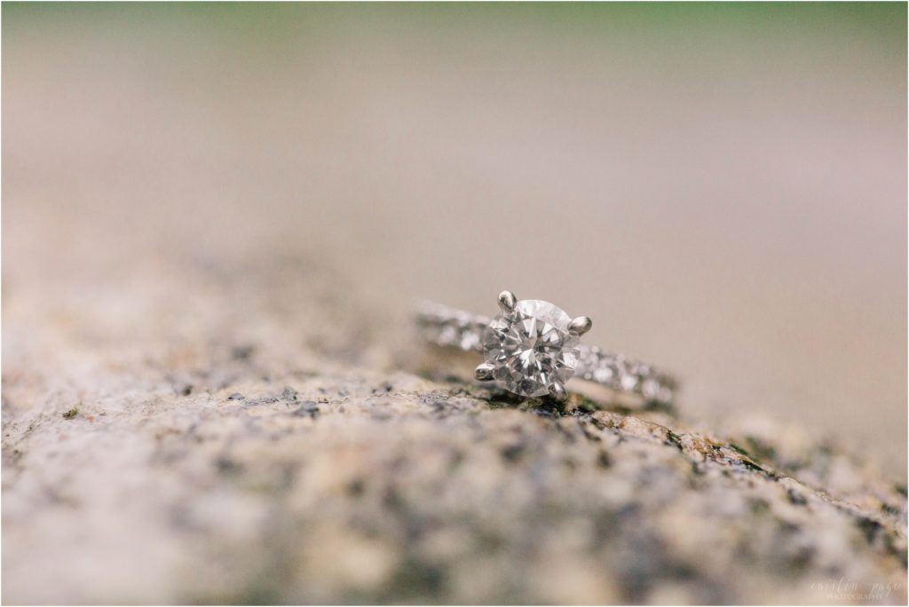 Engagement ring on rock