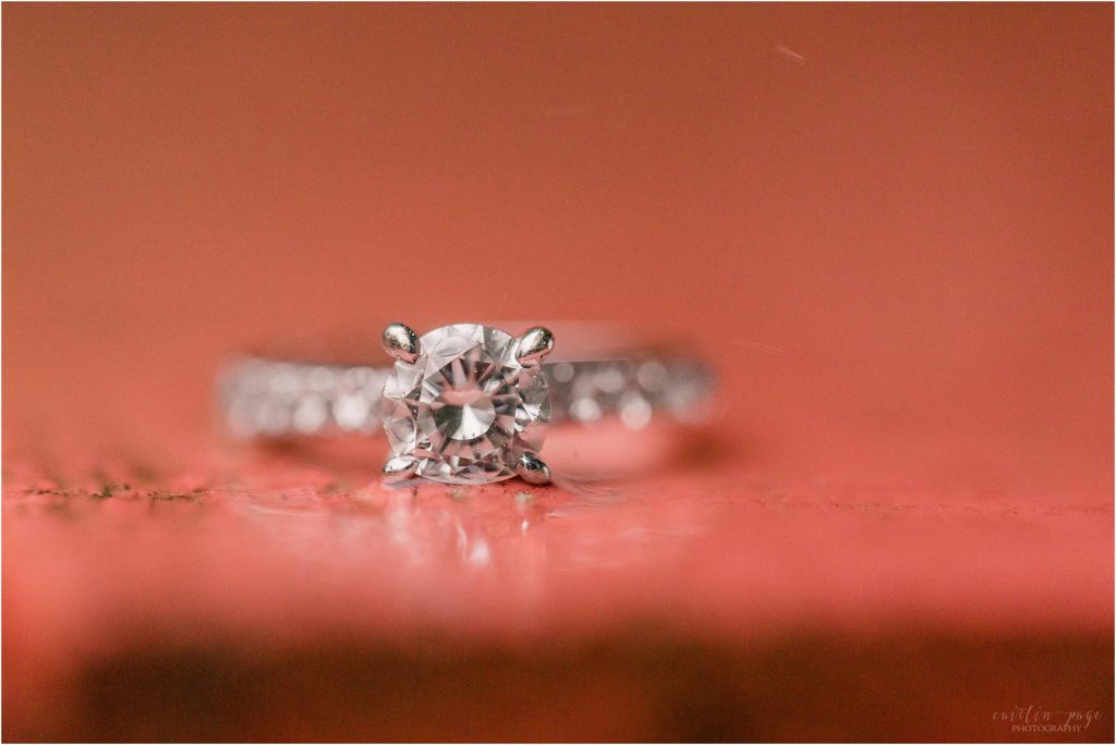 Engagement ring on red surface