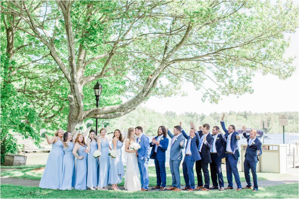 bridal party in front of lake