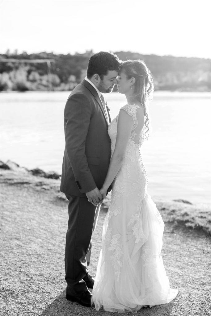 black and white portrait of bride and groom at sunset