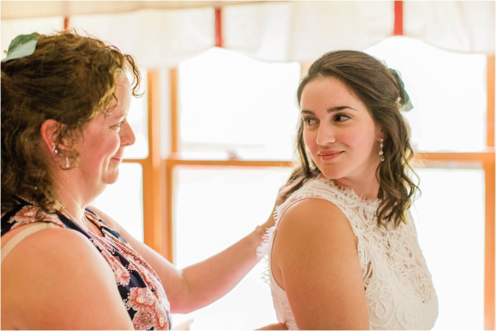 mom and bride looking at each other