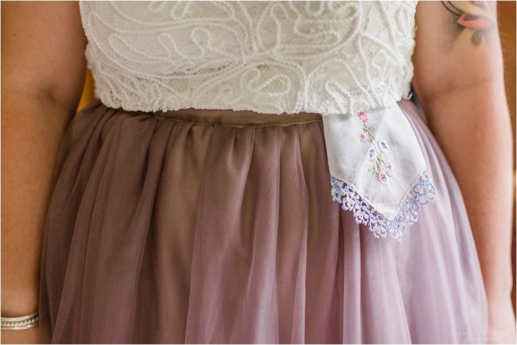 handkerchief tucked in brides skirt