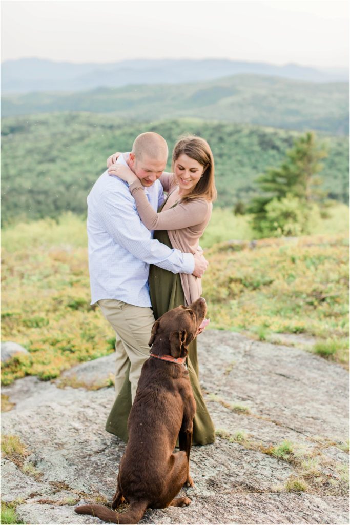 couple looking at dog