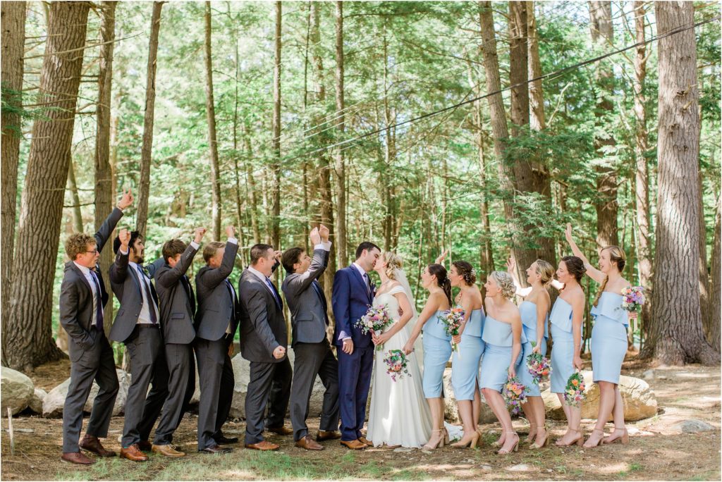 Bridal party in the woods cheering