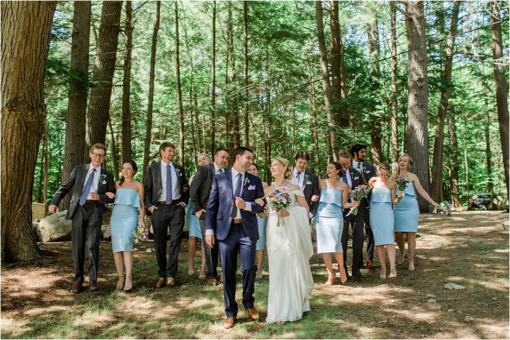 Bridal party walking in the woods