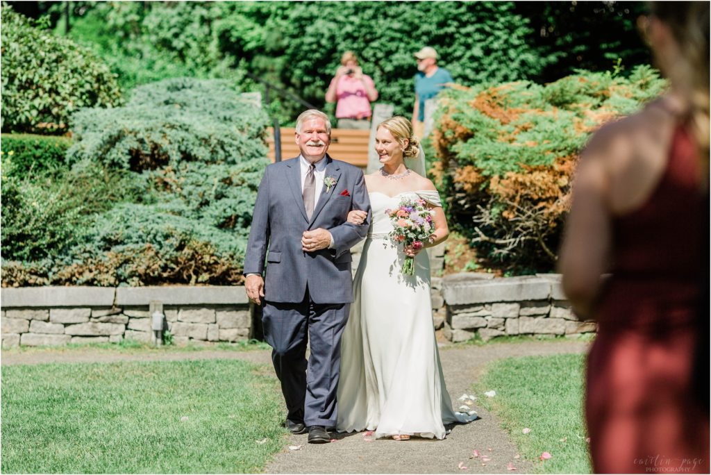 Bride and dad walking down the aisle at Cate Park Wolfeboro