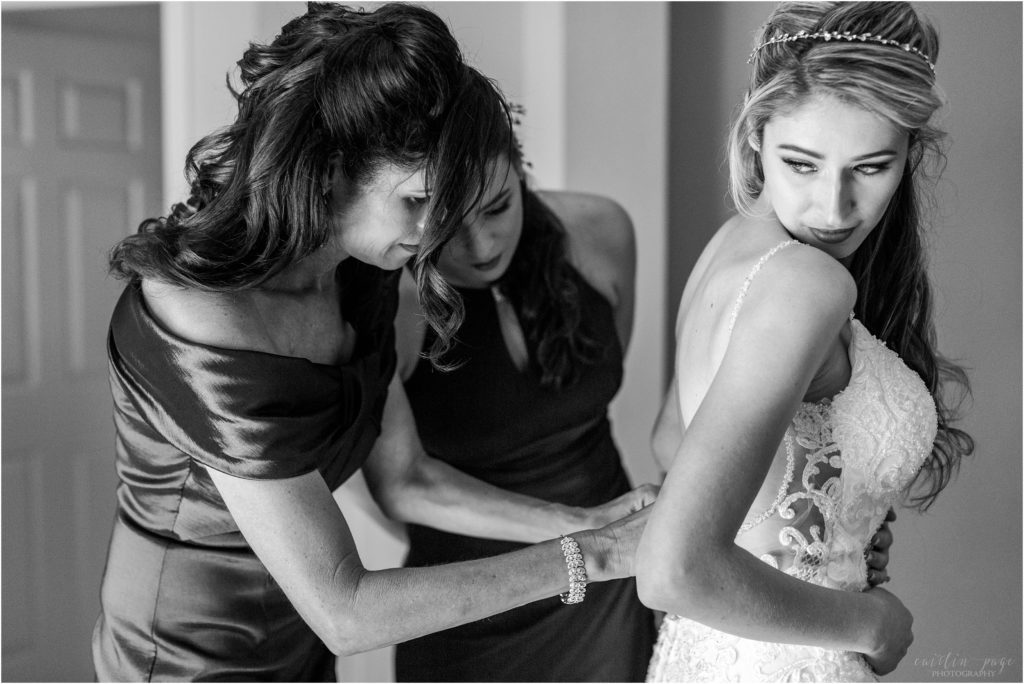 mom and daughter helping bride get ready