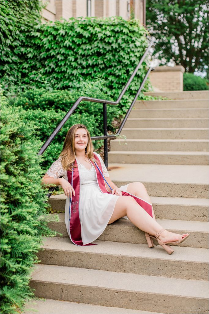 Senior girl sitting on steps of Brewster Academy