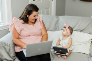 Baby girl and mom working on laptops
