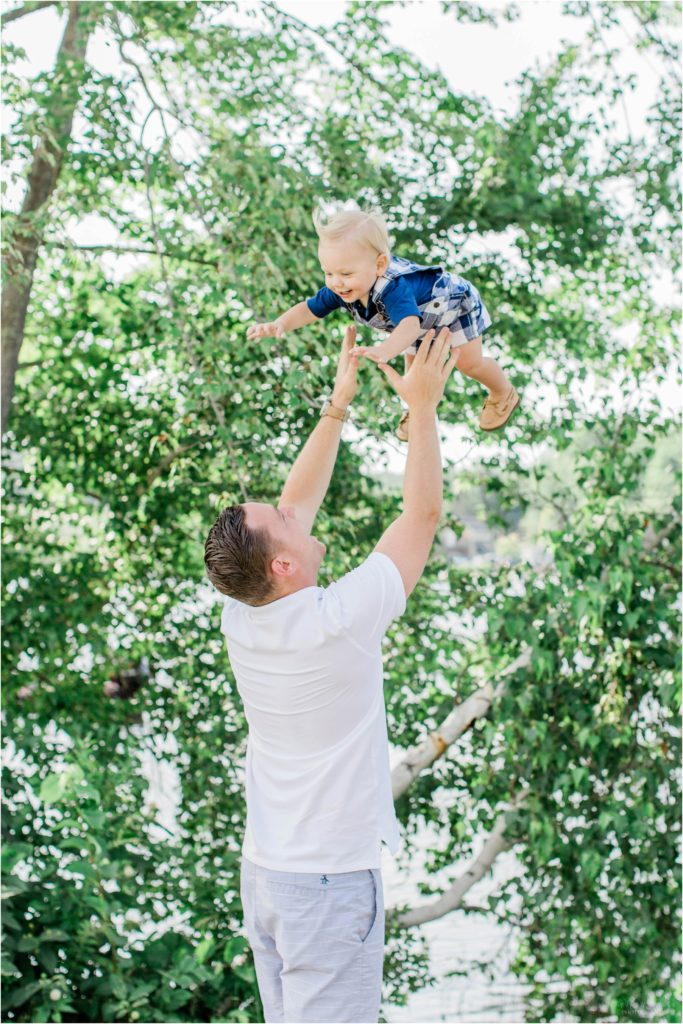 Dad throwing baby boy in the air