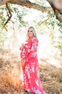 Pregnant woman standing under tree at sunset Coto de Caza California