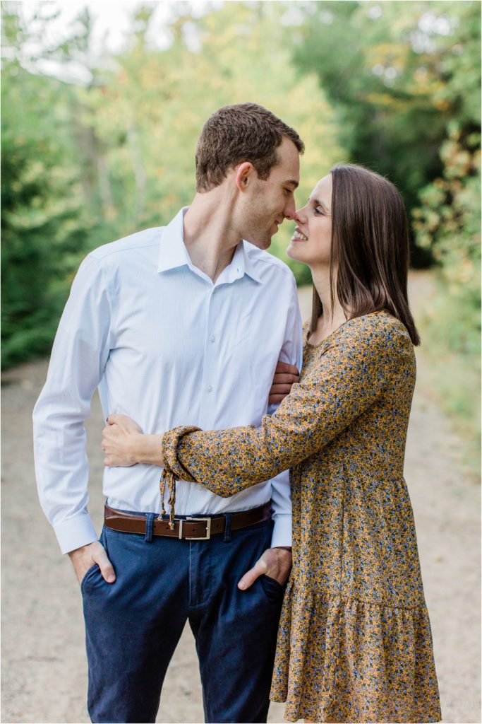 couple snuggled together for engagement photos