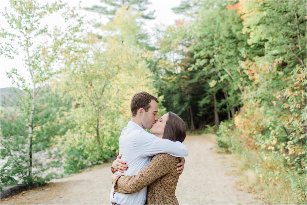 man hugging woman engagement photos