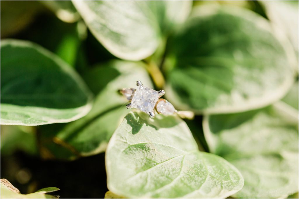 square vintage engagement ring in green leaves
