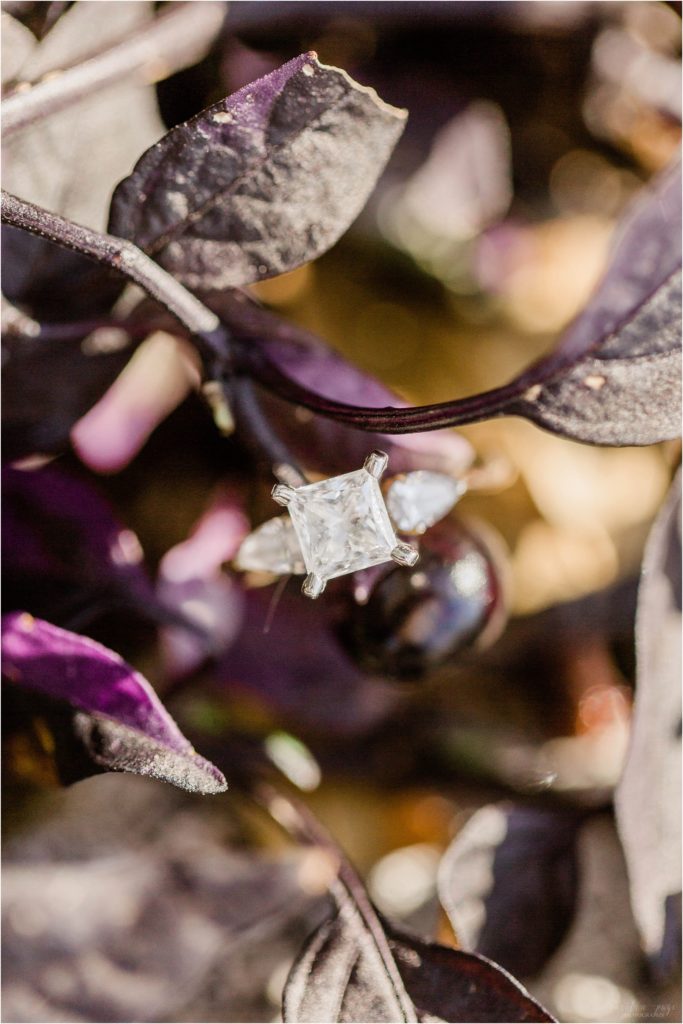 square vintage engagement ring in purple and black leaves