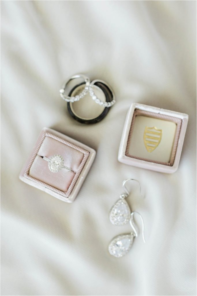wedding rings in pink mrs. box with diamond earrings