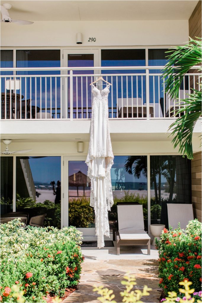 wedding dress hanging off of balcony railing