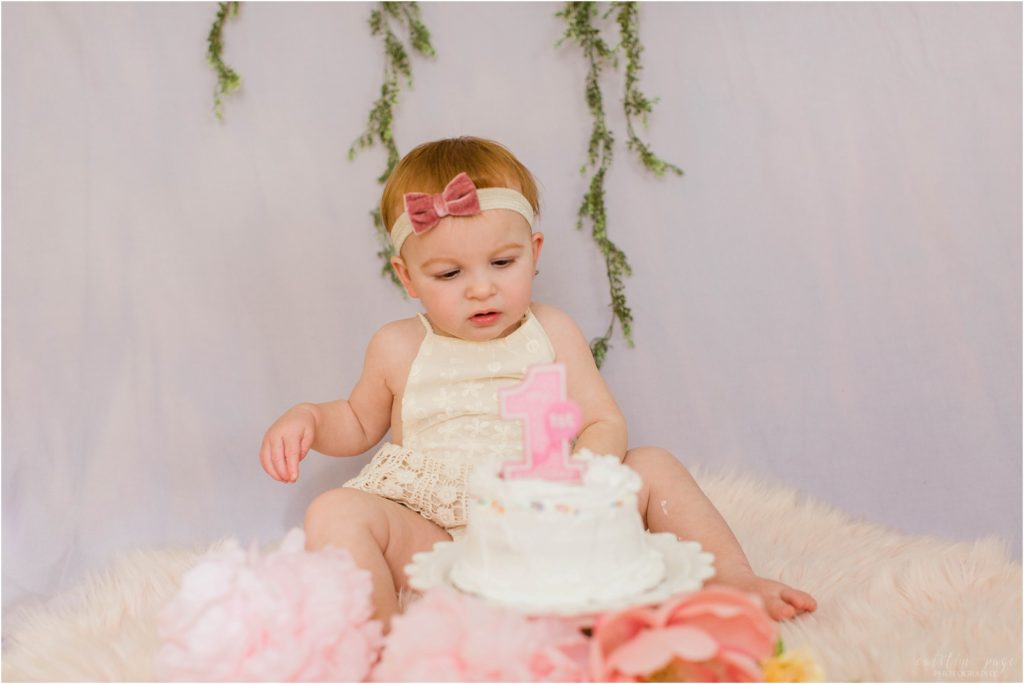 toddler girl with smash cake