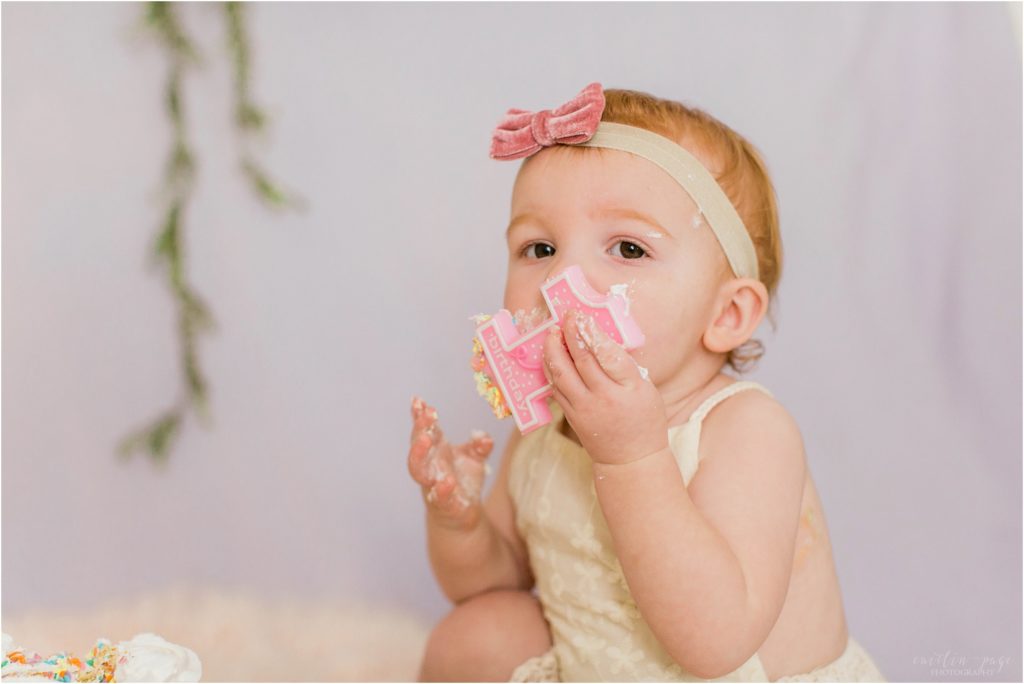 toddler girl with smash cake