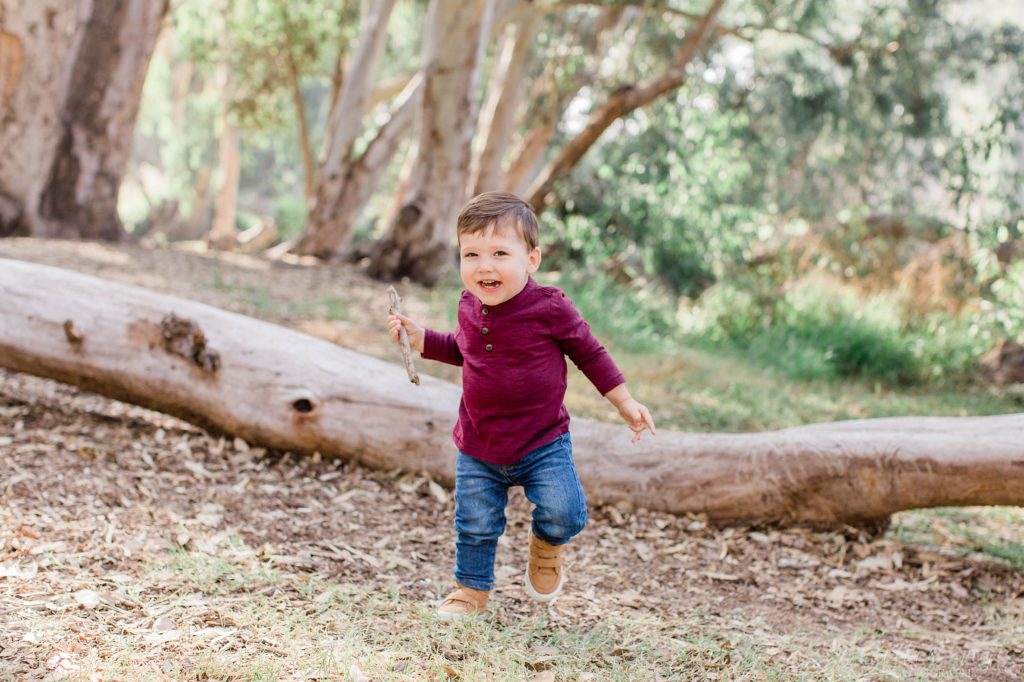 Little boy running towards camera