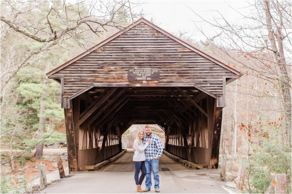 Man and woman standing in front of Albany covered bridge