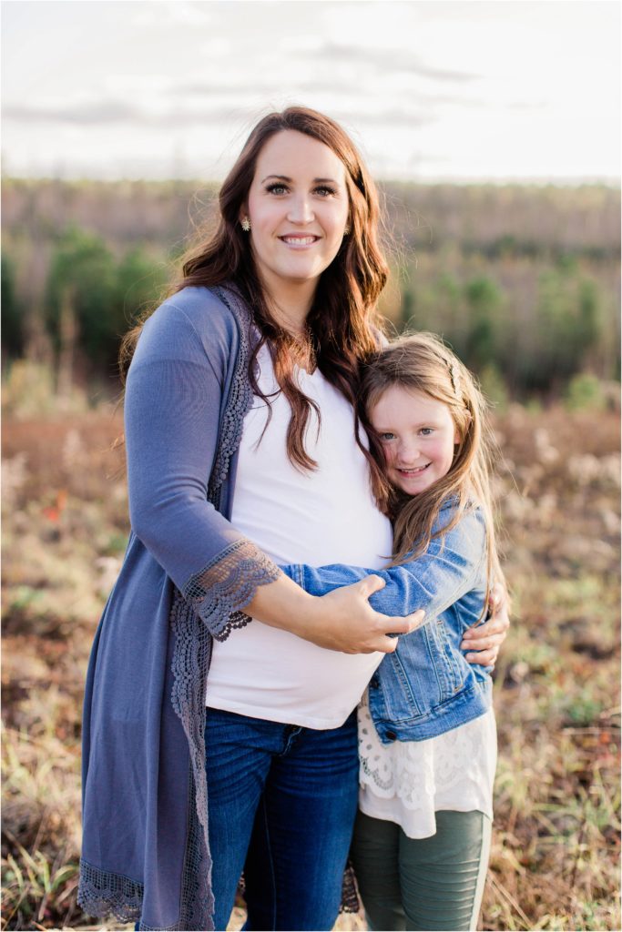 Older girl hugging mom