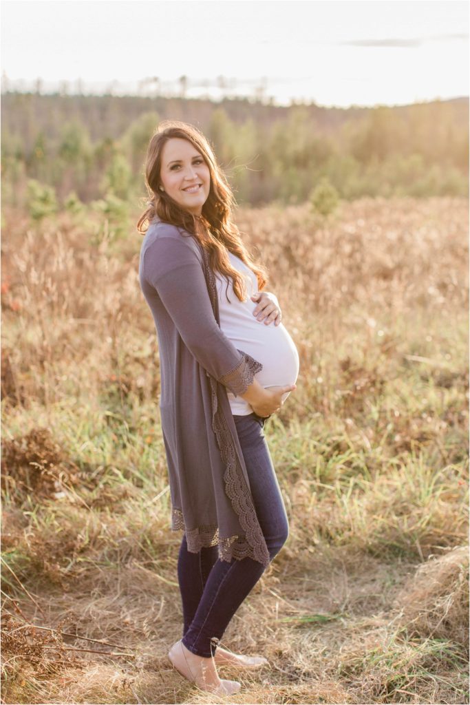 Pregnant woman standing in field