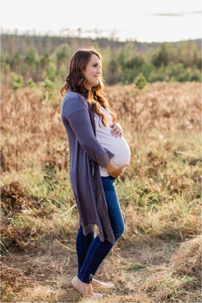 Pregnant woman standing in field