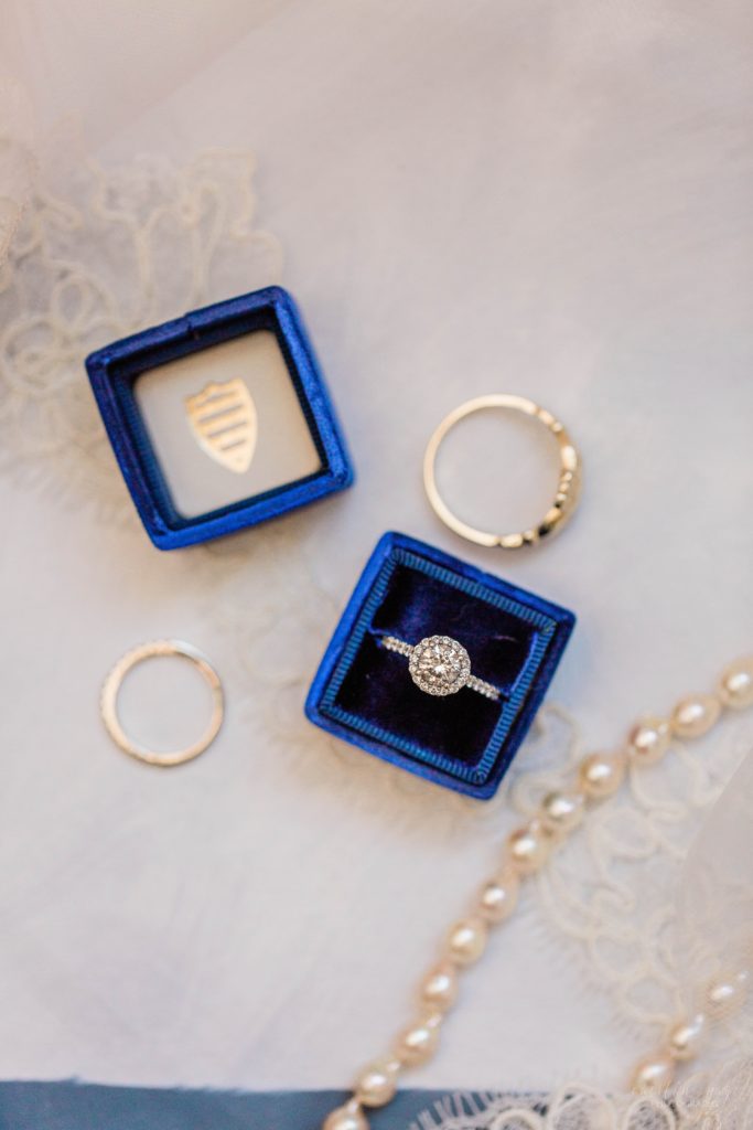 Wedding rings with blue and burgundy wedding details