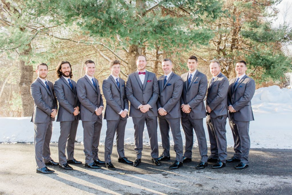 Groomsmen standing together in gray suits