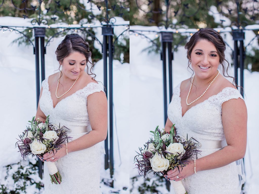 Bride standing outside in snow holding bouquet