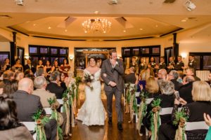 Bride and groom walking down the aisle together