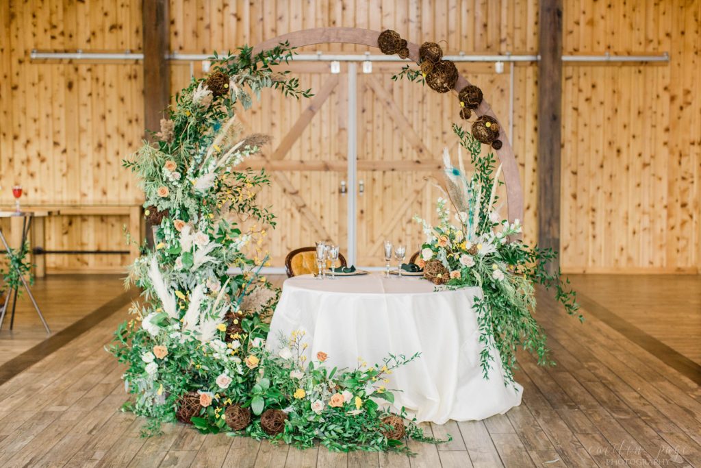 Head table hoop with floral display