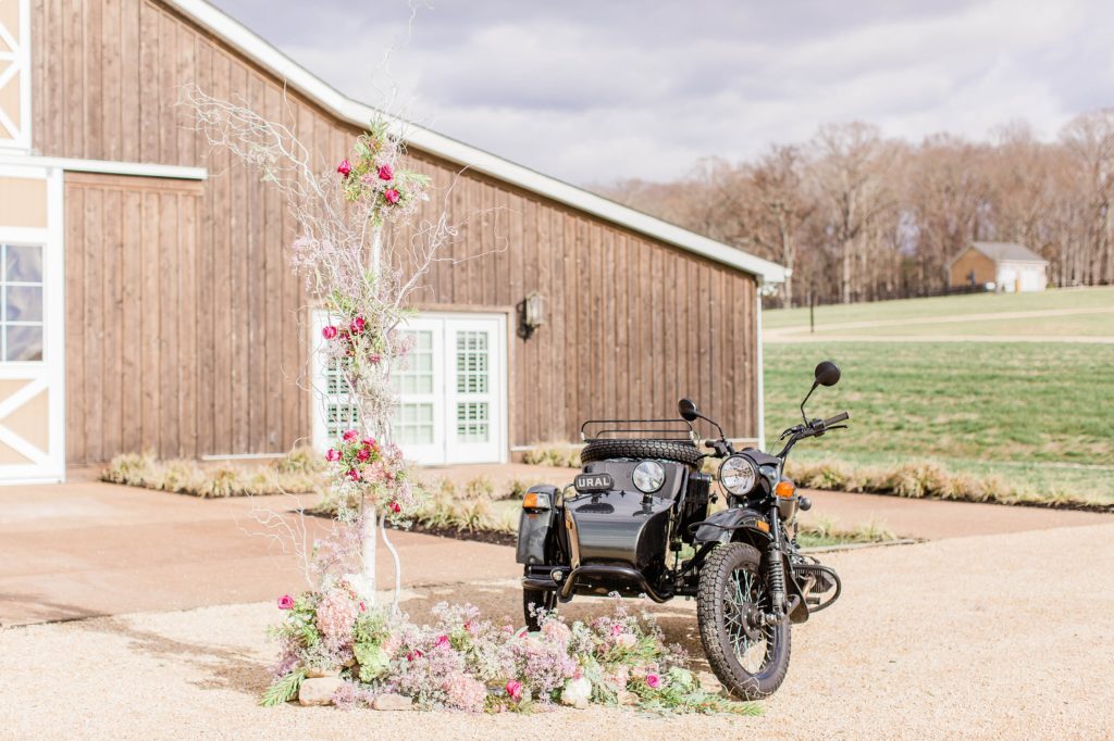 Vintage motorcycle set up with floral display at Mount Ida Farm in Charlottesville Virginia