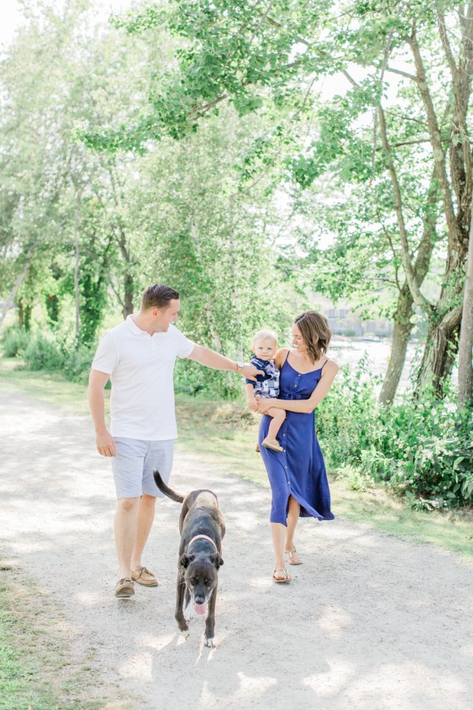 Young family walking along the water in Wolfeboro New Hampshire