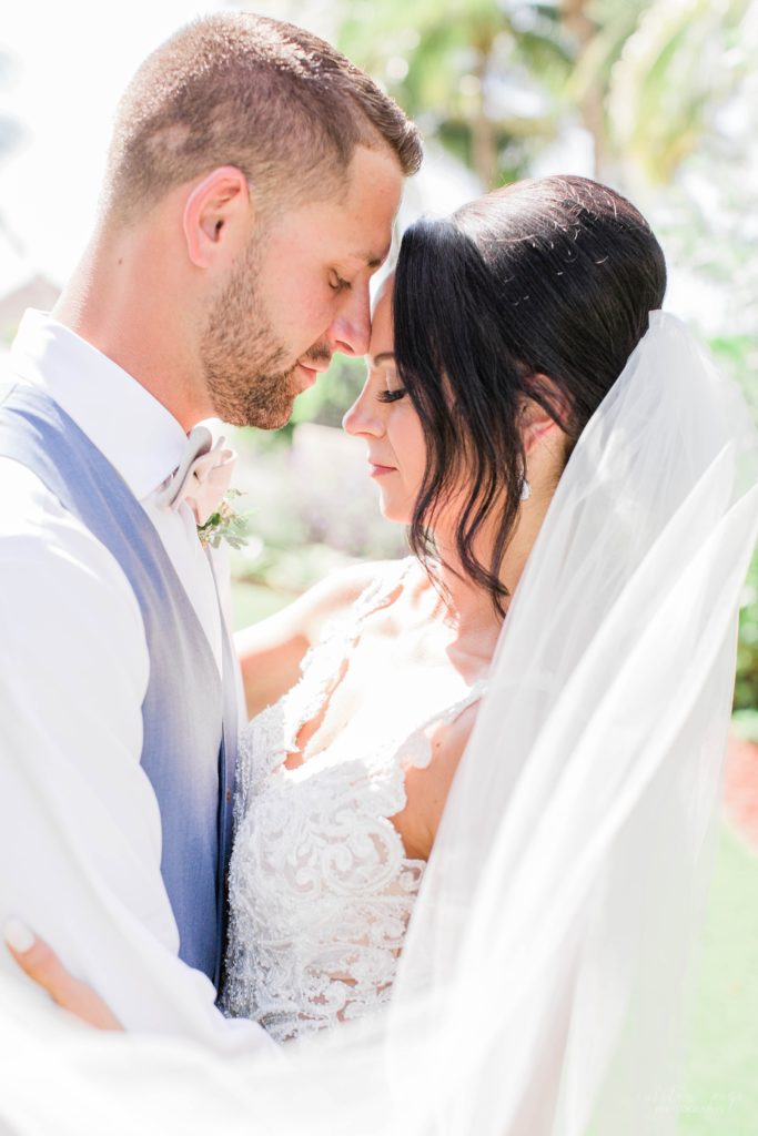 Bride and groom touching foreheads