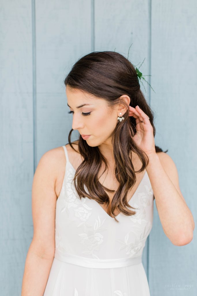 Bride tucking hair behind her ear