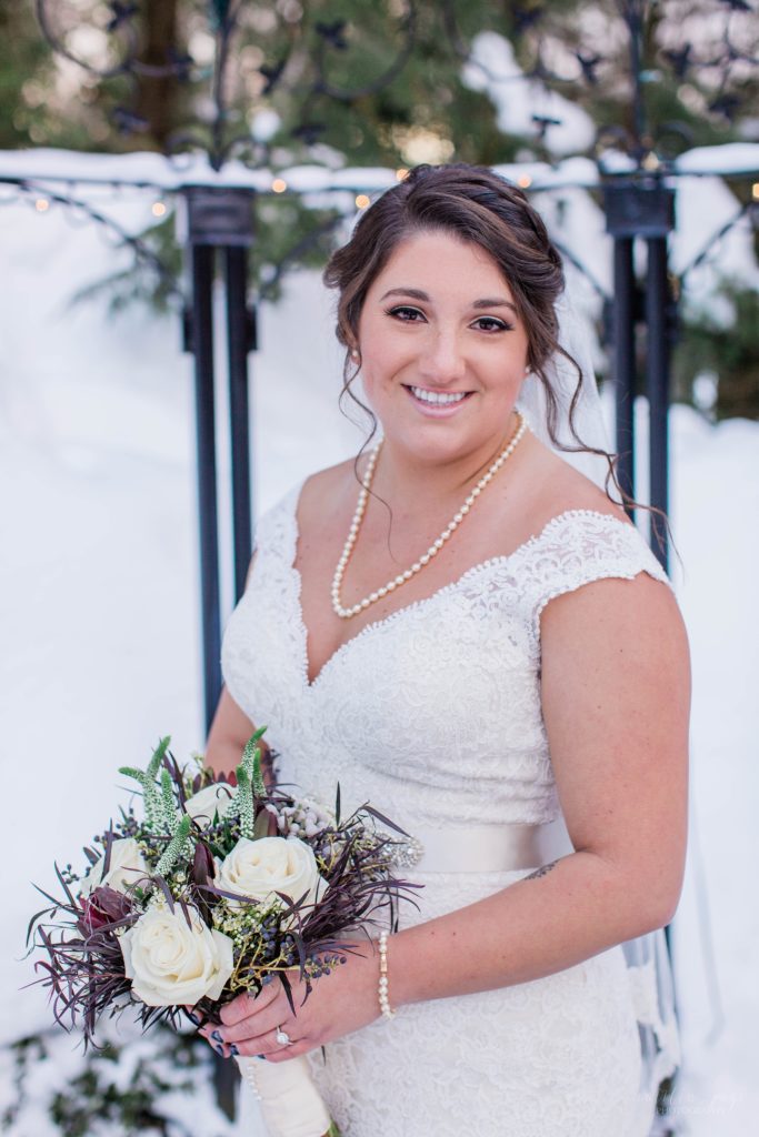 Winter bride standing in snow